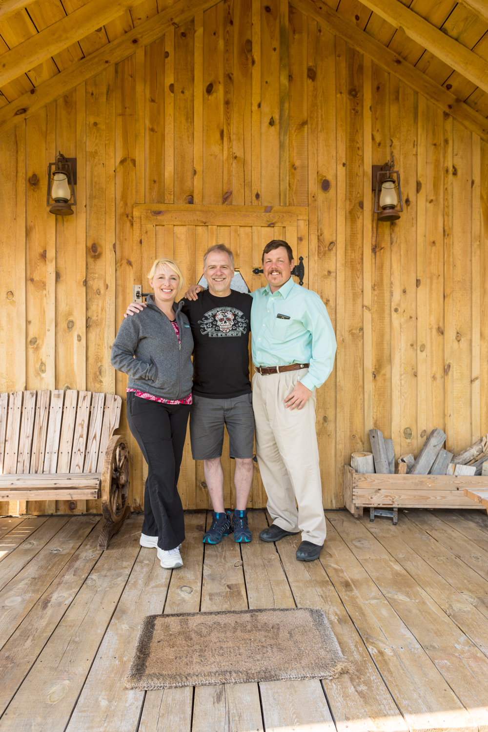 Stephanie and Tom with Deke in front of their Bunkhouse