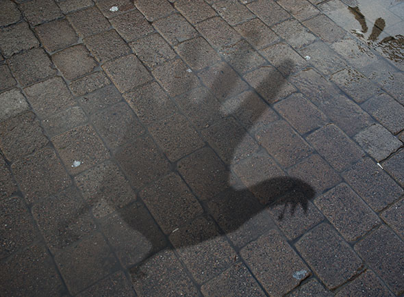 A shadow of a hand made into a hand turkey