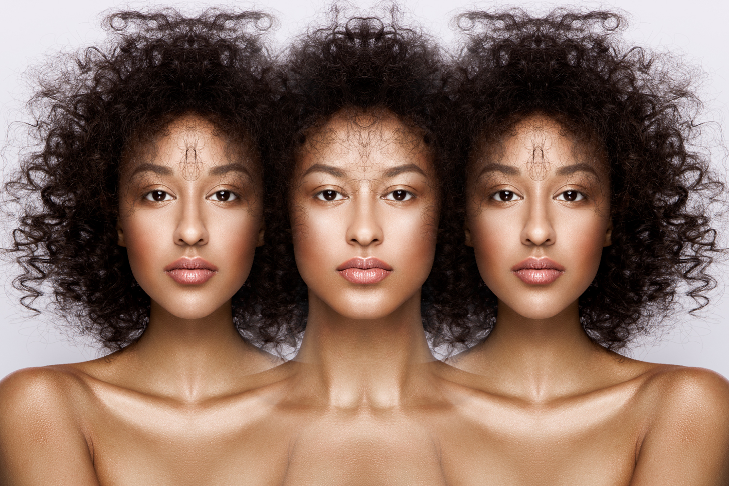 A triad of portraits containing symmetrical variations