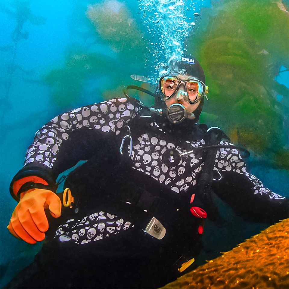 Diver Deke underwater with his skull patterned drysuit. 
