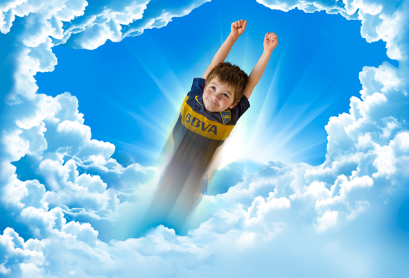Boy flies through the clouds courtesy of Photoshop